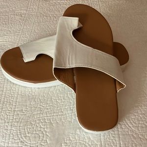 White slip on sandals. Not leather.